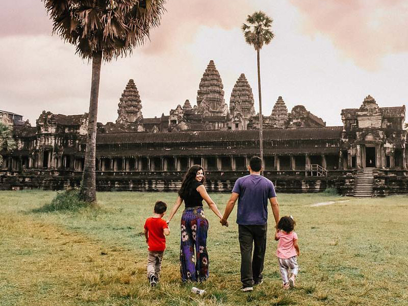 Family of 4 walking towards Angkor Wat